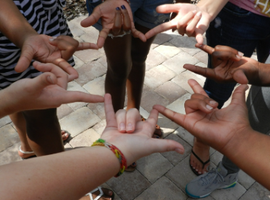 Photo of people using sign language